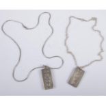 Two hallmarked silver ingots on silver chains. 60g.