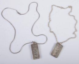 Two hallmarked silver ingots on silver chains. 60g.
