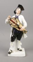 After Meissen, a continental Cries of Paris figure of a man with a hurdy gurdy. Height 21.5cm.