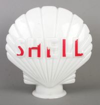 A glass Shell advertising sign/petrol pump globe. Height 44cm.