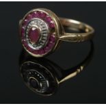 A vintage 9ct gold ruby set ring. Size O, 2.65g. Missing one stone.