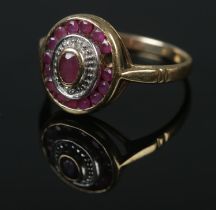 A vintage 9ct gold ruby set ring. Size O, 2.65g. Missing one stone.