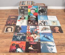 Two boxes of assorted records, to include Abba, Meatloaf, Bob Marley, Madness, Paul McCartney, The