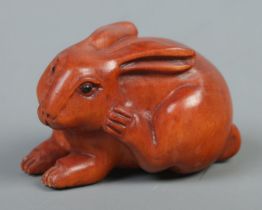 A Japanese carved Netsuke in the form of a rabbit