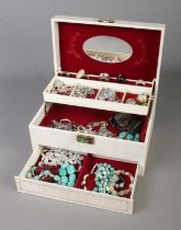 A vintage cantilever jewellery box with contents of costume jewellery to include bracelets, rings,