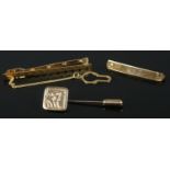 A 9ct gold bar brooch along with a 9ct gold tie clip and 9ct gold stick pin. 5.94g.