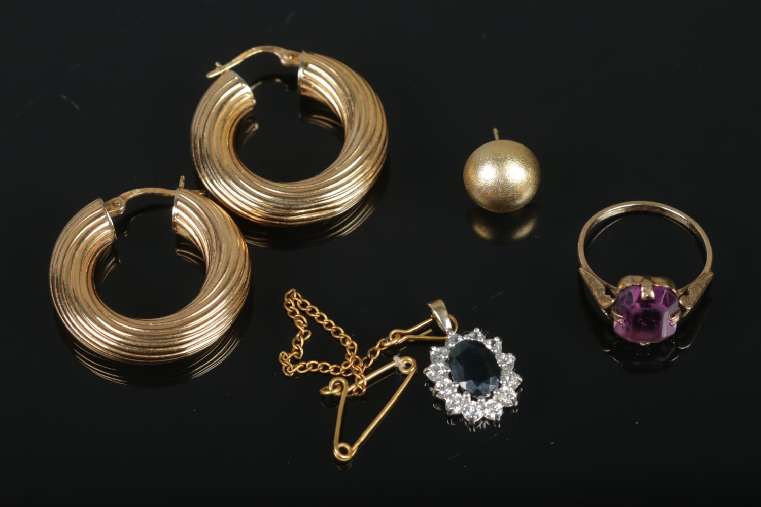 A collection of 9ct jewellery to include pair of hoop earrings, ring and pendant. Total weight 8.5g.