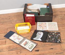A box of assorted stamps, first day covers and postcards to include Victorian Penny Red, Royal