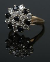 A 9ct sapphire and cubic zirconia cluster ring. Size J, 2.5g.