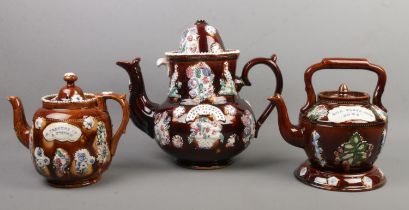 Three Victorian bargeware teapots. Includes a large local example marked for Mr Thomas Ainsworth,