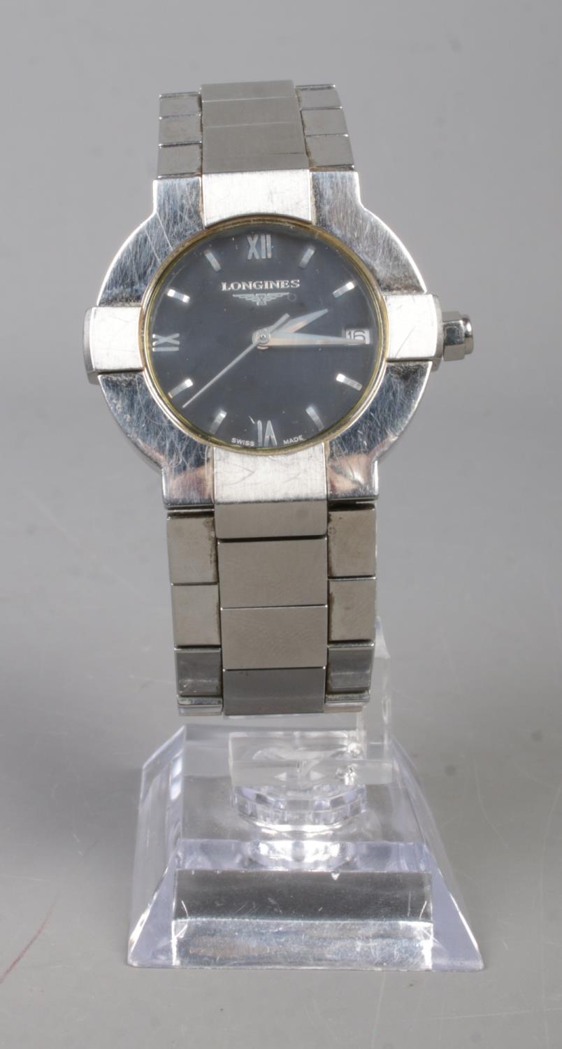 A men's Longines stainless steel wristwatch featuring date display. In working order.