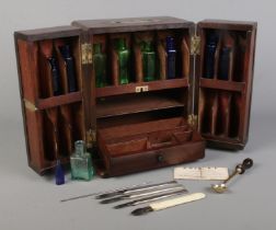 A late 18th/early 19th century mahogany medicine cabinet with brass mounts. Having fitted interior