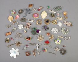 A good collection of costume jewellery brooches to include mother of pearl, floral, cameo, etc.