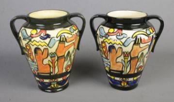 A pair of 'Charlotte Rhead' Crown Ducal twin handled vases decorated with Egyptian scenes Hx24.5cm