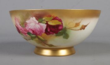 A Royal Worcester blush porcelain bowl painted with rose design, signed Spilsbury. Dated approx.