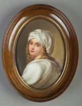 A hand painted porcelain plaque, portrait of a young maiden. In oval mahogany frame. Plaque 13cm x