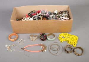 A good collection of assorted costume jewellery to include beaded necklaces, bangles, earrings, etc.