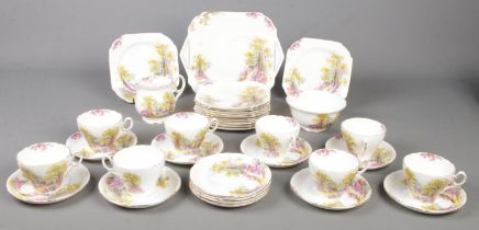 A quantity of Shelley Englands Charm 'Ideal' teawares. Includes cups & saucers, sandwich plate, milk