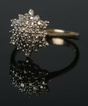 A 9ct diamond cluster ring. Size P, 3g.