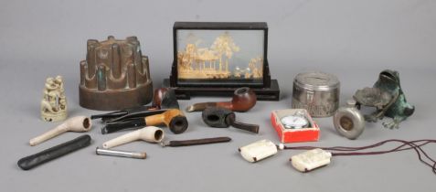 A quantity of collectables, to include boxed TIM stopwatch, jelly mold, pipes and money box.