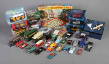 A box of assorted diecast vehicles to include Corgi, Auto Art, Lesney, etc. Also include boxed Merit