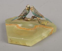 A vintage onyx ash tray/dish surmounted with a pair of cold painted bronze budgerigar. Base 7cm x