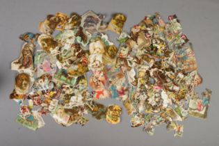 A large quantity of Victorian scraps of cat and dog theme