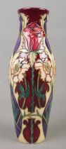 A Moorcroft pottery vase decorated in the Masquerade pattern by Rachel Bishop. Signed to base.