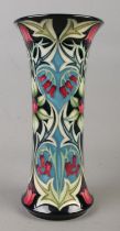 A Moorcroft pottery vase decorated in the Isabella pattern by Sian Leeper. Date cypher for 2004.