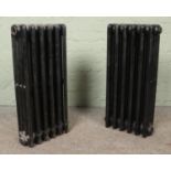 Two painted six-bar cast iron radiators. Height: 75cm.