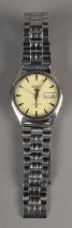 A Seiko 5 automatic water resistant men's watch with cream face and luminescent hands. Day and