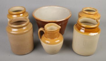 A collection of stoneware jars and similar items