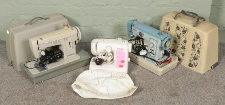 Three sewing machines. Includes Singer Featherweight, Jones and Merritt.