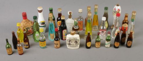 A collection of assorted alcohol miniatures to include Millefiori, Martini, Sangria, Palo Tunel,