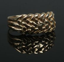 A 9ct gold keeper style ring. Size O. 3.18g. Slightly misshaped.