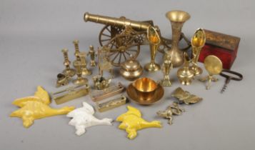 A collection of mostly brass items including large brass canon, vases and trinket box, various