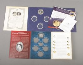 Two London Mint Office coin albums both holding one coin. Includes Nine Decades Gloriously