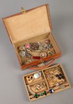 A Viking leather jewellery box with contents. Includes vintage brooches, dress rings, etc.