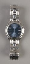 A Seiko kinetic auto relay water resistant men's watch with blue face . Date function. Stainless