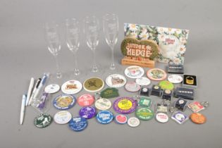 A collection of Lilliput Lane related items including members badges, key rings, pens, writing