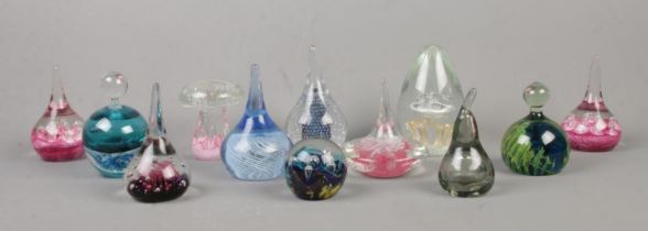 Twelve glass paperweights, to include mushroom, bubble and Polish examples.