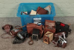 A box of cameras. Includes Olympus, Kodak Brownies, etc.