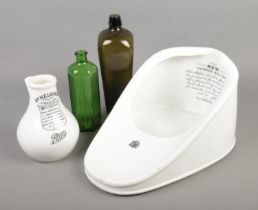 A New Slipper Bed Pan together with Dr Nelson's Improved Inhaler and two medicine bottles.