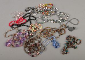A collection of beaded costume jewellery necklaces to include glass beaded examples.