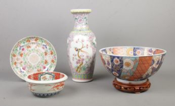 A quantity of oriental ceramics, to include Chinese famille rose vase, Koi bowl on wooden stand
