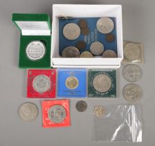 A box of coins. Includes silver George III 1816 shilling, commemorative crowns, etc.