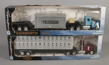 Two boxed NewRay Long Hauler Collection models. Includes Kenworth W900 and Peterbilt Model 379.