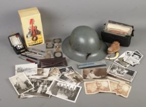 A quantity of collectables. Includes WWII Zuckerman Civil Defence helmet, coins, postcards, silver