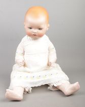 An Armand Marseille bisque headed doll, marked AM 341/5K to the back. 49cm tall.