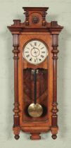 A walnut Vienna style wall clock with 8 day movement